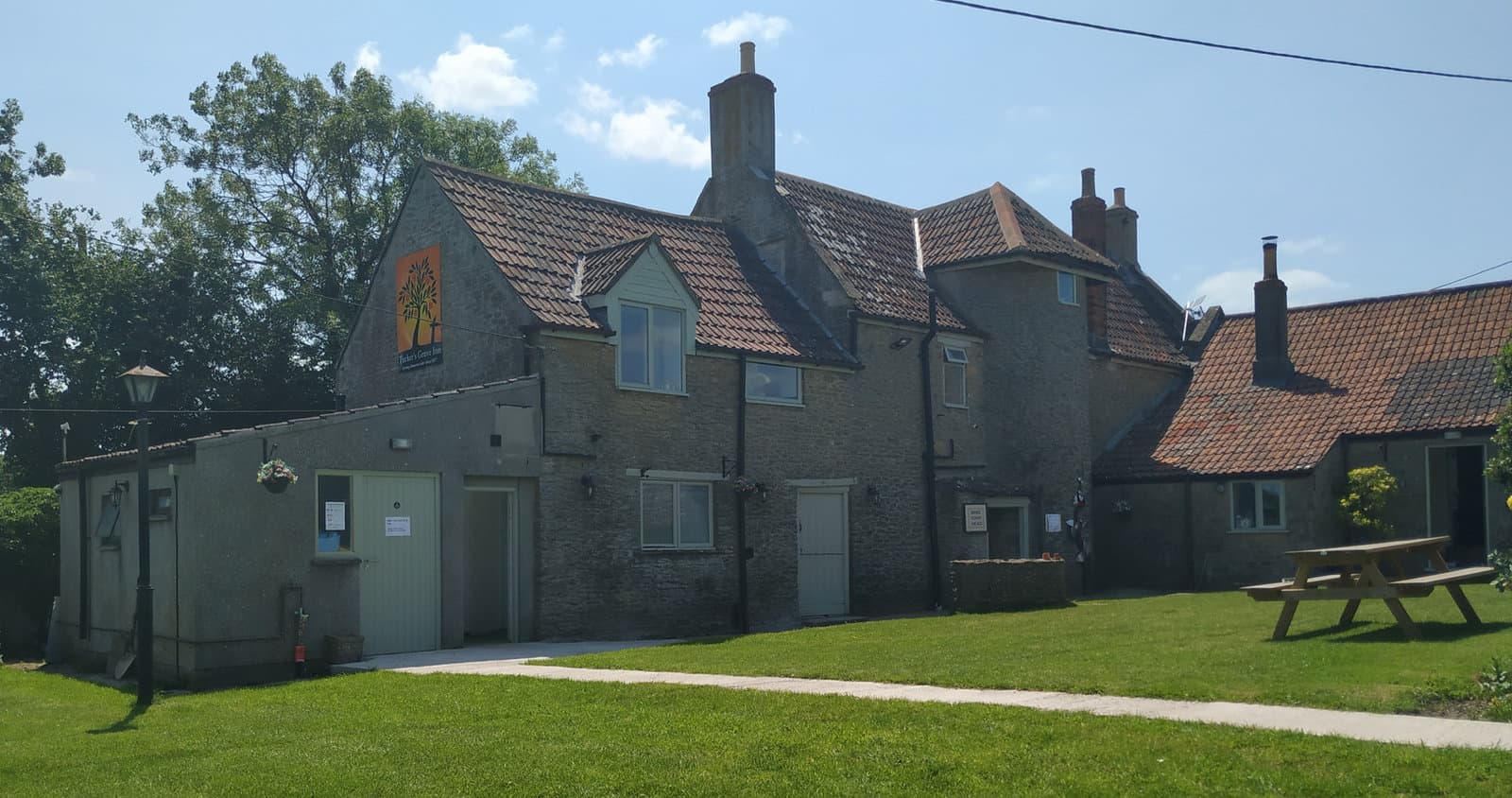 The inn and its lawns on a bright summer day